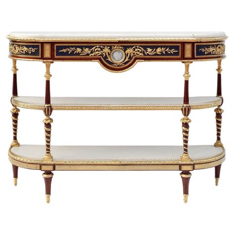 Louis XVI style console sideboard in mahogany with three flattened half-moon shaped superposed trays and a straight apron with a curved central notch. It stands on four high spinning top legs, topped by composed shaped uprights: inversed twisted and gilt balusters and fluted balusters. Rich chiselled and gilt bronze ornamentation such as notched plates, friezes of eggs and water leaves and an openwork hearts frieze balcony on the inferior tray, water leaves and grapes on uprights, laurel leaves Traditional Console Tables, Bronze Decor, Console Table Styling, Sideboard Console, Louis Xvi Style, Antique Design, Classic Furniture, Carrara Marble, Beautiful Furniture