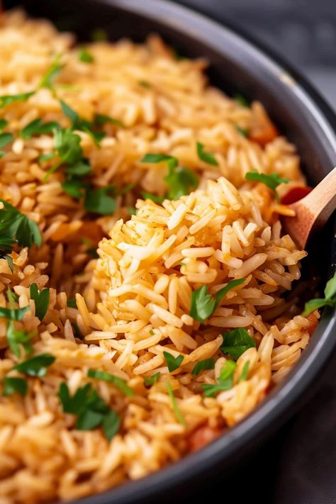 This copycat recipe for Texas Roadhouse seasoned rice is so easy and so good! Skip boxed rice and make this tasty homemade dish instead. Brown Rice And Wild Rice Recipes, Instant Pot Seasoned Rice, Roasted Vegetables And Rice, Fancy Rice Dishes, Rice Side Dish Recipes For Steak, Texas Road House Rice, Brown Rice Recipes Seasoned, Flavorful Rice Recipes, Texas Roadhouse Rice