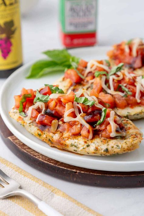 This Trader Joe's Bruschetta Chicken only uses 5 main ingredients, but is bursting with flavor! It's a light and healthy meal when served with a green salad. Or, serve it over pasta or rice. Either way, you'll love how this dish will be on your table in about 15 minutes! This dinner recipe are made with Trader Joe's ingredients: Trader Joe's Bruschetta Sauce, balsamic glaze, an arugula. It is perfect for an Trader Joe's easy meal! Trader Joe’s Bruschetta Sauce, Trader Joes Bruschetta Recipes, 4 Ingredient Trader Joes Meals, Trader Joe’s Balsamic Glaze Recipes, Trader Joe’s Bruschetta, Simple Trader Joe’s Meals, Trader Joe’s Meals, Trader Joes Meals, Bruschetta Sauce