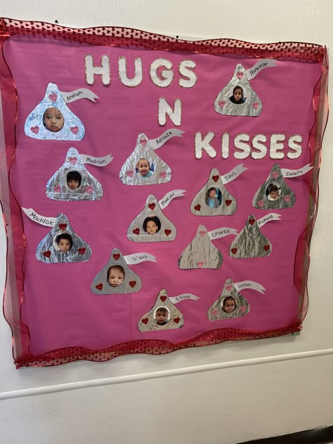 Valentine’s Day Classroom Bulletin Board, February Daycare Crafts, February Bulletin Board Ideas Infants, Projects To Do With Infants, Winter Door Decorations For Toddler Room, Hugs And Kisses Bulletin Board, Valentines Day Crafts Toddlers, Valentines Infant Crafts, February Cubby Tags