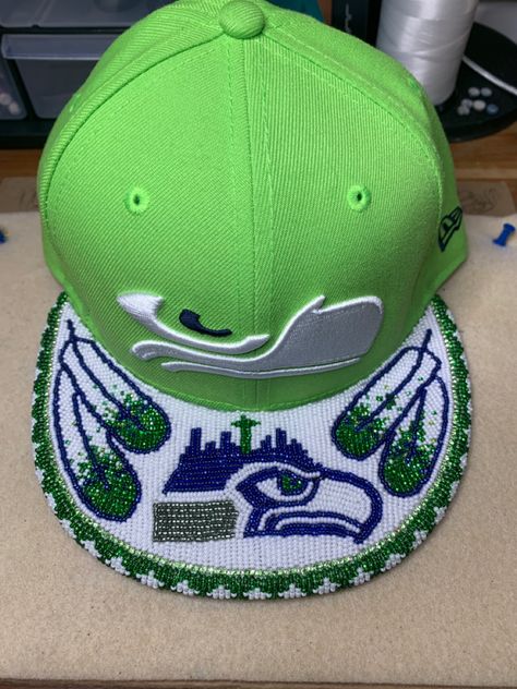 Seahawks native design Beaded Caps Native American, Native Beaded Hats, Beaded Baseball Caps Native American, Beaded Hats Native American, Beaded Caps, Beaded Shoe, American Quilts Patterns, Seahawks Crafts, Indigenous Beading