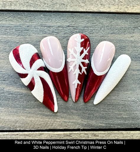 Dawn Witch Designs Unique, re-usable, hand painted, and made in Canada. These luxury press on nails are handmade using high quality gel polish and salon-grade materials.  ✨ RED PEPPERMINT SWIRL ✨  This manicure features red chrome tips and white sugared detailing on the peppermint swirl and snowflake. It's a showstopper! *The shape shown in the pictures is the LONG STILETTO *Colours may appear a little different due to your personal monitor setti Snow Miser Heat Miser Nails, Peppermint Acrylic Nails, Metallic Red Christmas Nails, Red White And Green Nails Christmas, Christmas Acrylic Nails Medium Length, Holidays Nails Christmas, Christmas Berry Nails, Chrome Nails Christmas Designs, Glamorous Christmas Nails