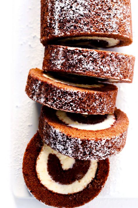 This amazing Chocolate Roll Recipe (a.k.a. "Chocolate Swiss Roll") is easy to customize with your favorite fillings (cream cheese is my fave!). Plus, it's also easy to make ahead and freeze. Perfect for holiday entertaining, and even giving away as gifts! | Gimme Some Oven #chocolate #cake #christmas #dessert Chocolate Cake Roll, Chocolate Swiss Roll, Chocolate Roll Cake, Cake Roll Recipes, The Recipe Critic, Recipe Critic, Chocolate Roll, Pumpkin Roll, Thanksgiving Dishes