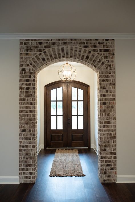 Backsplash Laundry Room, Archways In Homes, Laundry Room Floor, Brick Archway, Interior Brick, Brick Columns, Brick Interior Wall, Brick Interior, Brick Decor