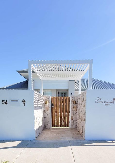 Coastal House Exterior, Raised Planters, Natural Stone Cladding, California Beach House, Front Facade, Sandstone Wall, House Fence Design, Stone Wall Cladding, Orange Shades