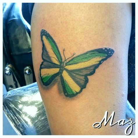 Butterfly tattoo by Maz. #tattoo #maz #inked #earlsfield #jamaica #inked #londontattoo #barrylouvaine Jamaica Tattoo For Women, Jamaica Flag Tattoo, Jamaica Inspired Tattoos, Jamaican Flag Tattoo Ideas, Jamaican Tattoos For Women, Jamaica Tattoo Ideas, Jamaica Tattoo, Jamaican Tattoos, Tattoos For Dad Memorial