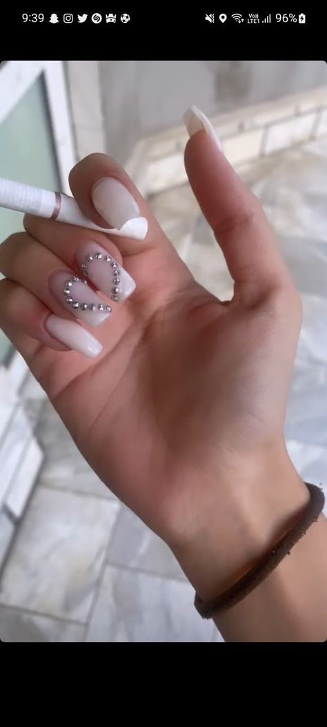 Red Nails With Heart Rhinestones, White Nails With Pearl Heart, White Nails With Heart Rhinestones, Pearl Nail Gems, Simple Nail Art With Gems, Acrylic Nails With Heart Rhinestones, Nails Acrylic Heart Design, Nails With Heart Gems, Gem Heart Nails