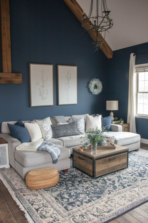 Discover the beauty of rustic charm and cozy comfort in farmhouse living rooms. Click here to explore. Farmhouse With Color Living Room, Cozy Great Room Ideas, Blue Room Ideas Living Room, Navy White And Wood Living Room, Navy Grey Cream Living Room, Living Room Grey Couch Blue Accents, Brown Blue White Living Room, Blue Grey House Decor, Blue Shiplap Living Room