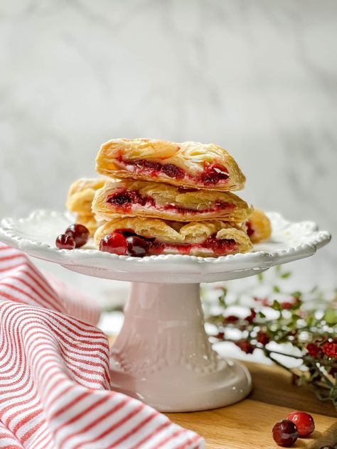 These easy Cranberry Cream Cheese Danishes will bring the holidays to your table! Twirls of flaky pastry are braided over layers of sweetened cream cheese and a delicious cranberry filling with hints of cinnamon and citrus. Every bite of this glazed braided danish is holiday-worthy! Cranberry Danish, Candy Cane Cream Cheese Danish, Cherry Candy Cane Danish, Raspberry Cream Cheese Candy Cane Crescent Danish, Candy Cane Danish Strawberry, Thanksgiving Food Gifts, Baked Cranberry-brie Puff Pastry Appetizer, Braided Danish, Cream Cheese Danishes