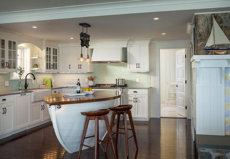 Nautical themed kitchen centers on a boat shaped center island accompanied by a butcher block counter lined with wooden tractor stools which are illuminated by a Restoration Hardware Cast Iron Barn Door Trolley Pendant. Beach Style Kitchen, Nautical Kitchen, Coastal Deco, Coastal Kitchen Design, Deco Marine, Custom Kitchen Island, Small Kitchen Island, Beach Kitchens, Shore House