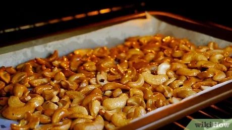 4 Ways to Roast Cashews - wikiHow Roasting Cashews In The Oven, How To Roast Cashews In Oven, How To Roast Cashews, Roasting Cashews, Honey Roasted Cashews, Cashew Recipes, Roasted Cashews, Conventional Oven, Roasted Nuts