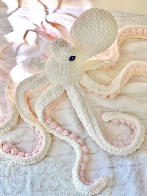 This Anchor the Octopus oversized crocheted plushie features an ivory body with light pink suckers and large black safety eyes. She makes for the perfect baby shower or birthday gift or just because! She will just make you smile. Materials:: 100% polyester yarn and filling and plastic safety eyes WARNING: although they are securely fastened internally  please supervise children under 3 years old with plushies featuring safety eyes. Care:: spot clean or hand-wash and lay flat to dry. For heavier cleaning, wash in garment bag on gentle and lay flat to dry Measurements::  approximately 36" In diameter  Pattern:: humblechildco Crochet Projects Octopus, Cute Crochet Baby Things, Crochet Animals Aesthetic, Large Octopus Crochet Pattern Free, Crochet Giant Octopus, Cute Simple Crochet, Giant Crochet Plushies, Giant Octopus Crochet Pattern, Crochet Ideas Animals