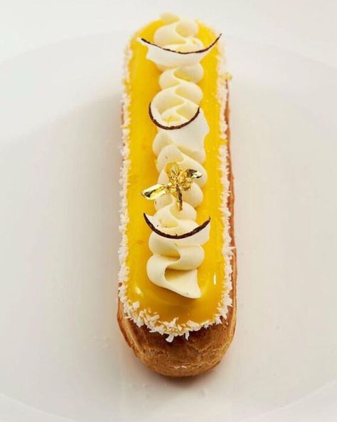 Lemon, coconut, dark chocolate and lemongrass eclair by @mjoksinski @savourpatissieroftheyear @ravifruitaustralia @rwphoto #eclair #savour… Churros Plating Ideas, Cruller Donuts, Choux Cream, Choux Buns, Petite Fours, Modern Recipes, Churros Recipe, Plate Presentation, A Spoonful Of Sugar