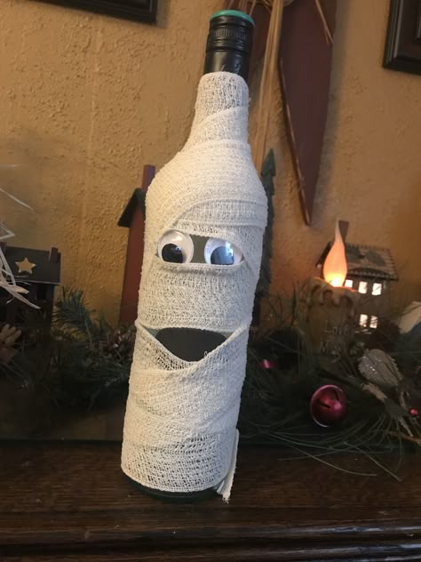 Mummy wine bottle Mummy Wine Bottle, Ghost Wine Bottles, Halloween Bottle Decorations, Halloween Bottle Crafts, Wine Bottle Halloween Crafts, Wine Bottle Mummy, Wine Bottle Halloween, Halloween Wine Bottle Crafts, Halloween Wine Bottles