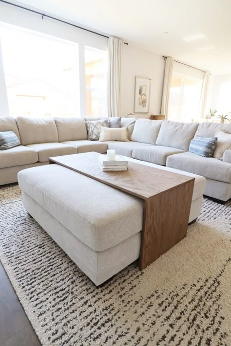 DIY Over-Ottoman Coffee Table – Home with Emily Jean Coffee Tables Ottoman, Living Room Designs Ottoman, Grey Couch With Ottoman Living Room, Cozy Ottoman Coffee Tables, Sectional Ottoman Ideas, Ottoman With Leather Couch, Couch And Ottoman Ideas Living Room, Living Room Decor Ottoman, Couch With Ottoman And Coffee Table