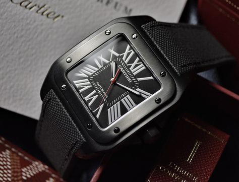 For 2016, Cartier have gone back to basics and refreshed two of their most popular models in a black carbon ADLC (Amorphous Diamond Like Carbon) coating. The Cartier Santos 100 XL and the Ballon Bleu de Cartier aren’t the first pieces to be done in the carbon cases, but Cartier are now offering buyers a... View Article Cartier Santos 100 Xl, Cartier Watches Mens, Borrowed Time, Cartier Santos 100, Mens Bling, Mens Casual Watches, Unique Watches, Car Owner, Iwc Watches