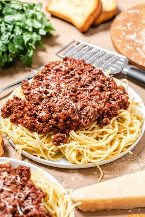 This Homemade Meat Sauce is thick, hearty and super meaty! It uses a combination of lean ground beef and Italian sausage for the most amazing flavour. Serve it over spaghetti topped with parmesan or use it in a lasagna for an extra special dinner the whole family will enjoy! Recipe available on queensleeappetit.com Best Meat Sauce Recipe, Sausage Ground Beef Recipes, Italian Meat Sauce Recipe, Speggetti Sauce Recipe Meat, Spaghetti Red Recipe, Spaghetti Meat Sauce Ground Beef, Best Spaghetti Meat Sauce Recipe, Meat Sauce Spaghetti, Homemade Spaghetti Meat Sauce With Fresh Tomatoes