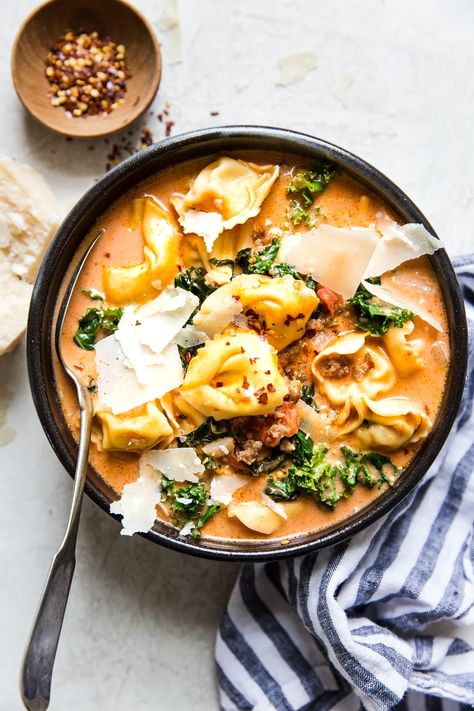 This ultra Creamy Tortellini Soup with Italian Sausage and Kale is a perfect for cold nights and the 30 minute dinner of your dreams. Tortellini Soup With Italian Sausage, Soup With Italian Sausage, Sausage And Kale, Sausage And Kale Soup, Creamy Tortellini Soup, Tomato Tortellini Soup, The Modern Proper, Sausage Tortellini, Modern Proper