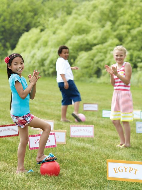 Three children play a game of Moses' Kickball Croquet outside. Moses Games For Kids, Bible School Games, Jesus Games, Games To Play Outside, Sunday School Games, Church Games, Children Games, Outside Games, Super Sunday