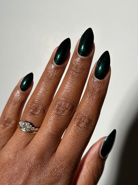 Dark emerald green shimmer 10-free. Vegan. Cruelty-free. Nontoxic. We suggest using a base coat and 2-3 coats of polish followed by a top coat. This polish comes with a removable handmade decorative bronze cap atop our standard black matte nail polish cap - merging artistry with function. To forego bronze caps on your order click here. Swatches by @eviltwinnails @polish.d_ @melly.k.nails @melanted.mani