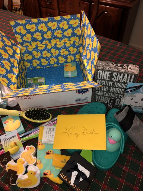 Duck care package. Included yellow and blue items, rubber ducky, gift cards and things for our “Lovey Duck” Duck Gifts Diy, Duck Gifts Ideas, Rubber Duck Ideas, Rubber Duck Gift Ideas, Duck Themed Gifts, Duck Things, Duck Care, Rubber Ducky Decor, Rubber Duck Birthday