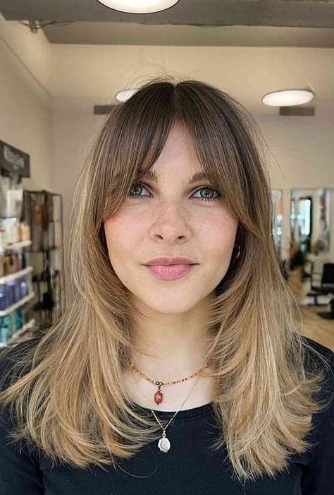 a medium blonde butterfly haircut with a darker root and front plus bottleneck bangs is adorable Blonde Butterfly Haircut, Dark Chestnut Hair, Bottleneck Bangs, Light Brunette Hair, Dark Chocolate Hair, Medium Length Blonde Hair, Long Hair Highlights, Bangs Ideas, Medium Length Blonde