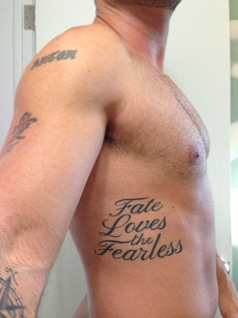 Fate loves the fearless Fearless Tattoo Men, Fate Tattoo, Fearless Tattoo, Masculine Tattoos, Writing Tattoos, Chest Tattoo Men, Small Tattoos For Guys, Sleeve Men, Rib Tattoo