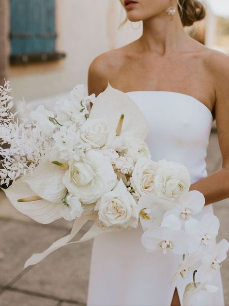 stunning all white wedding bouquet for the modern bride, or the bride seeking a classic wedding colour palette. click below to organise an appointment with our creative director for your wedding goals All White Floral Bridal Bouquet, Bridesmaid Bouquet With Orchids, White Luxe Wedding, Wedding White Flowers Bouquet, White Bouquet With Orchids, Boho Orchid Bouquet, Modern White Floral Wedding, White Wedding Flowers 2023, Luxe Boho Wedding