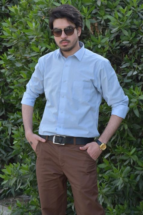 M. Sheheryar Naseer in a light blue shirt along with brown pant #MSheheryarNaseer #Sheheryar #SheheryarNaseer #Sunglasses #Rayban #Watch #Lightblueshirt #Brownpant #photography #man #male #men #menstyle #mensfashion #fashionformen #fashion Brown Pants Blue Shirt Men, Blue Shirt Brown Pants, Stylish Poses, Brown Sling Bag, Audition Outfit, Fall Bottoms, Stylish Mens Suits, Light Blue Shirt, Pants Outfit Men