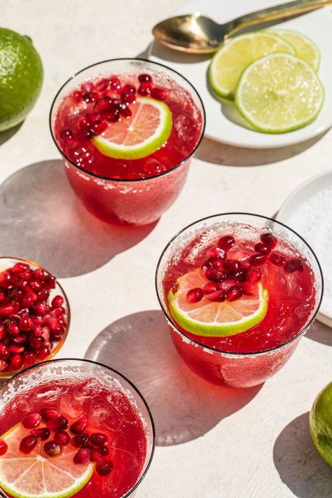 Next time you’re having people over, mix up a big batch of these Pomegranate Margaritas! Pomegranate juice gives this margarita a fruity twist without straying too far from the OG cocktail we all know and love. This recipe makes a serving big enough for a crowd, and you’ll all be going back for more! Pomegranate Margarita Mocktail, Cranberry Pomegranate Margarita, Pomegranate Margarita Pitcher, Party Margarita Recipe, Pomegranate Margarita Recipe Pitcher, Pomegranate Juice Cocktails, Fall Margarita Ideas, Pomagranet Margarita, Christmas Margaritas For A Crowd