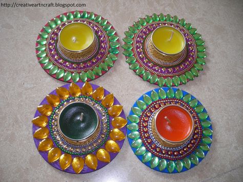 small lamp on cd Diya Making, Diya Designs, Timetable Ideas, Diya Decoration Ideas, Diwali Diya Decoration, Study Timetable, Diy Candle Making Kit, Diya Decoration, Making Candles Diy