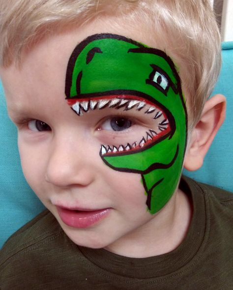 Over the eye green dinosaur face paint T-rex. Perfect for a prehistoric birthday party! #birthdayparty #facepainting #Snohomish #Marysville # Lake Stevens #Everett #Mukilteo #Monroe Dinosaur Face Paint, Face Paint Ideas For Kids, Paint Dinosaur, Paint Ideas For Kids, Kids Face Painting Easy, Face Painting Halloween Kids, Dinosaur Face Painting, Easy Face Painting Designs, Animal Face Paintings