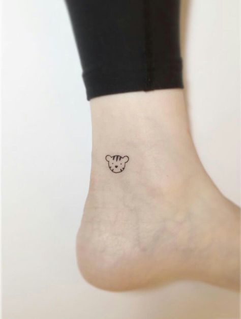 Tiny Tiger Tattoo Minimalist, Small Tiger Tattoo For Women Simple, Cute Cartoon Tattoos For Women, Tiger Ankle Tattoo, Cartoon Tiger Tattoo, Cartoon Lion Tattoo, Small Tiger Tattoo For Women, Minimal Tiger Tattoo, Tiny Tiger Tattoo