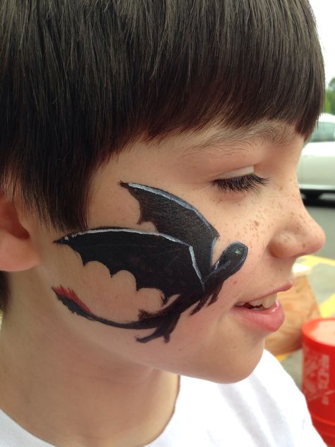 toothless" as the boy requested. www.bunnymurals.com Dragon Face Paint, Dragon Face Painting, Face Painting Tips, Face Painting For Boys, Cheek Art, Chinese New Year Dragon, Dragon Face, Painting Stencils, Kids Face Paint