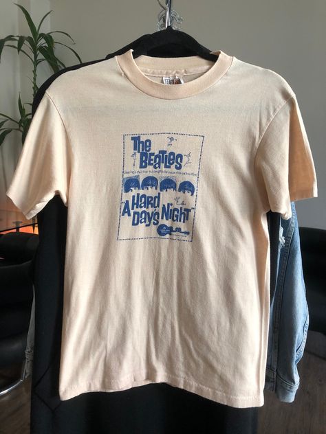 "Vintage Single Stitch \"Hard Days Night\" Beatles Movie T-Shirt ('64) \"Hard Day's Night\" was released in 1964. This shirt was purchased between 1964-198? and has had 1 owner. Crew neck seam coming apart in front from wear (See Photos) Tag Reads Men's Size : Medium Made in USA 50% Cotton 50% Polyester Willing to Answer Any and All Questions about Items. All Items Sold AS IS. No Refunds. No Returns. Note* Items are not laundered unless adopted personally before selling, to reduce costs & to Band Merch T-shirt With Vintage Print, Vintage Band T Shirts 70s, The Beatles T Shirt, Beatles Movie, Vintage Beatles Shirt, Beatles Shirt, Beatles Band, Beatles Tshirt, Gucci Sweater