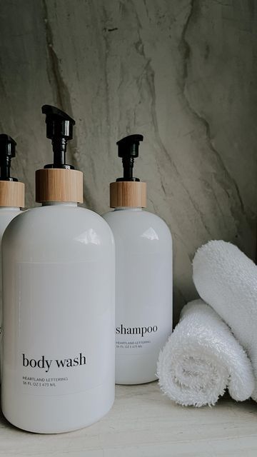 CIARA RAYSHALL | CONTENT CREATOR on Instagram: "When self-care meets aesthetics. Is it crazy that organized labels get me excited? I grabbed these super cute body wash, shampoo, & conditioner refillable dispensers from @heartlandlettering off Amazon and they add such a cohesive look to our 2nd bathroom! Don't they match the shower tile perfectly!!? Too many colors with different brands give clutter energy to me so this bamboo, black and white pallet was it! They have other colors and letter styles, so you can upgrade your home decor game with these stylish and eco-friendly refillable dispenser bottles too! Shop my #LTK now and elevate your space with sustainable elegance. I also added them to the “LINKS” highlight in my profile! 🔗 Content & sound inspired by @itsjessicalindsay ✨📸" Black And White Pallet, White Pallet, Letter Styles, Organizing Labels, Upgrade Your Home, Shampoo Conditioner, Shower Tile, Shampoo And Conditioner, Content Creator