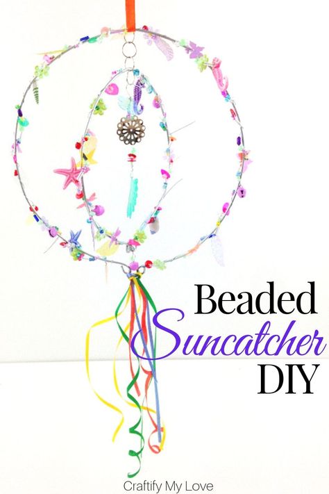 Sparkly seaquined and beaded suncatcher hoop mobile to add a pop of colour to your garden. Click through for a detailed tutorial on how to make this wind spinner for little money. #craftifymylove #suncatcher #windwpinner #windchime #DIYgardendecor #summercraft #DIYhomedecor Beaded Suncatcher, Mobile Diy, Suncatcher Diy, Beaded Diy, Thrift Store Upcycle, Thrift Store Crafts, Floral Arrangements Diy, Diy Mobile, Upcycled Home Decor