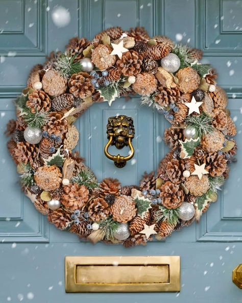 Reminiscent of snow dusted Winter woodland, this giant Christmas wreath is perfect for making a striking statement, and is particularly suited to larger front doors or windows. Make a statement with this woodland inspired wreath. Densely packed with blueberries, ivy, hand painted wooden stars, frosted silver blue baubles and an abundance of real woodland pinecones.Delivered to you in a sustainably sourced packaging box, perfect for presenting as a gift or use again to protect your wreath to enjo Giant Christmas Wreath, Heart Door Wreath, Extra Large Wreath, Ivy Wreath, Blue Baubles, Blue Berries, Jute Hanging, Needle Felted Christmas, Christmas Door Wreaths