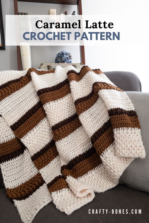 Off white, caramel, and brown striped blanket with a pattern variation being displayed over the back of a couch Heart Crochet Blanket, Crochet Blanket Patterns Free, Crochet Baby Blanket Tutorial, Stitch Techniques, Crochet Throw Pattern, Heart Crochet, Crochet Afghan Patterns Free, Modern Crochet Patterns, Crochet Blanket Designs