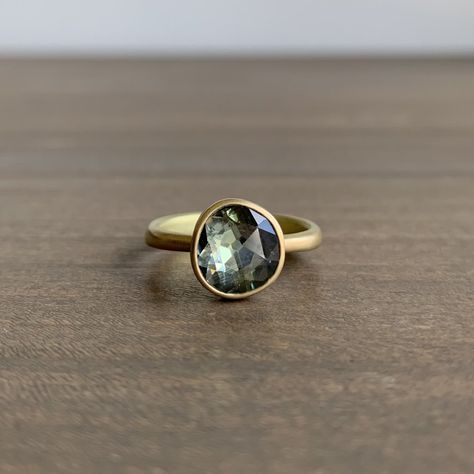 Lola Brooks Natural Grey Sapphire Ring. 2.56 carat grey sapphire bezel set in 18k yellow gold. This ring and other similar pieces are available at Meeka Fine Jewelry. #greysapphirering #greysapphire #18k #lolabrooks #finejewelry #futureheirlooms #lovegold Grey Sapphire Engagement Ring, Red Sapphire Ring, Boho Engagement Ring, Grey Sapphire, Oval Sapphire Ring, Green Sapphire Ring, Red Sapphire, Resin Jewellery, Diamond Engagement Wedding Ring