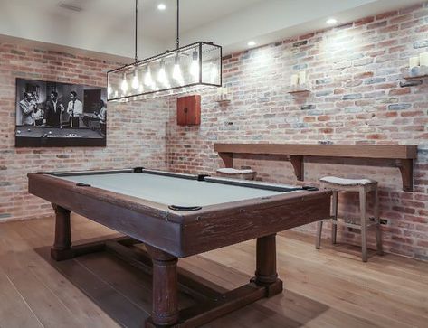 The brick walls on this basement really make it look more rustic and the small wood bar on the side and wood surround on the pool table make it just the right mix. Plus the wood floor improves the whole look. Basement Games, Pool Table Room, California Beach House, Basement Lighting, Rustic Basement, Game Room Basement, Small Basements, Pool Rooms, Lan Can