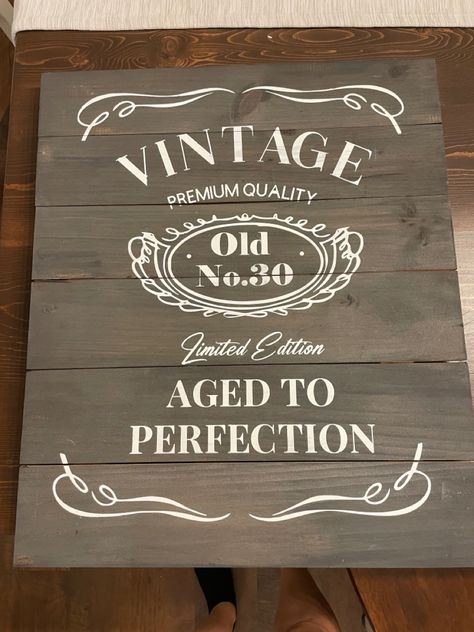 Fun DIY whiskey sign for a 30th birthday party! Pulled inspo from all over pintrest! To save dome money i found this sign at Goodwill and brought it down to the bare bones and stained it with some stain we already had at the house. Created a template using my Cricut and used a foam brush to dab paint over the template to prevent a lot of runs. This took quite a bit of time and patience but was an amazing centerpice for the party! Diy Whiskey, 30th Birthday Sign, Birthday Extravaganza, Big 30, Rustic Birthday, 30th Birthday Party, Age 30, 30th Birthday Parties, Aged To Perfection