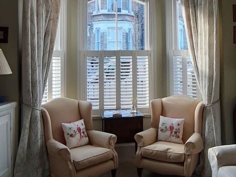 How to dress a bay window: shutters, blinds and more – The Shutter Shop Bay Window Shutters And Curtains, Bay Window Dressing Ideas, Shutters And Curtains Together, Curtains With Shutters, Bay Window Dressing, Windows With Shutters, Cottage Bathroom Design Ideas, Victorian Style Bedroom, Blinds And Curtains Together