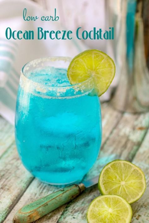 Enjoy this low carb cocktail recipe made with vodka and fruity sugar free syrups! Ocean Breeze is a bright blue sparking drink with 0 carbs and is full of tropical flavor. #lowcarbology #cocktail #lowcarb #vodka #tropical #summer #blue #oceanbreeze Low Carb Alcoholic Drinks, Sugar Free Cocktails, Cocktail Vodka, Lowcarb Recipes, Yummy Summer Drinks, Low Carb Cocktails, Sugar Free Drinks, Keto Cocktails, Beach Week