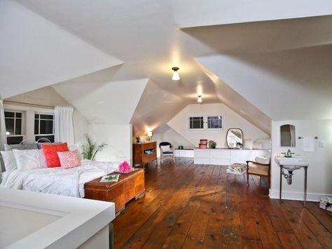 MASTER SUITE, AFTER: The walls were insulated with spray foam and covered with sheetrock to create an open-air master suite complete with a bed, bathroom and sitting area. Attic Master Suite, Rehab Addict, 1920s Bungalow, Nicole Curtis, Attic Makeover, Attic Renovation Ideas, Finished Attic, Bungalow Homes, Attic Design