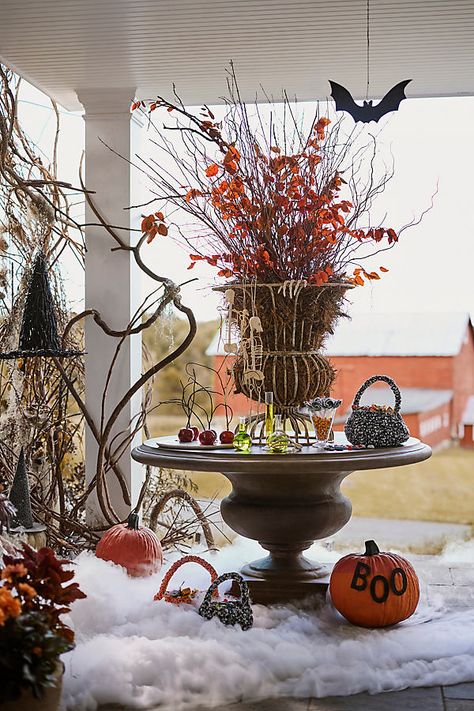 Handmade exclusively for terrain, this stately urn brings timeless style to the home or garden with its classical silhouette and weathered finish. Its open design pairs perfectly with a mossy lining or a drop-in pot. | Flared Wire Urn in White, Size: 26" at Terrain Fall Urn, Halloween Basket, Halloween Baskets, Halloween Centerpiece, Autumn Magic, Glass Pumpkins, Ritual Candles, Pedestal Dining Table, Hand Poured Candle