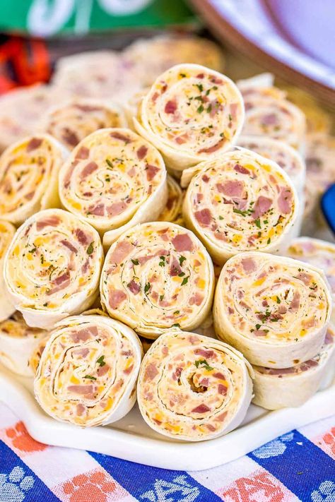 Ham & Cheese Pinwheels - I am ADDICTED to these sandwiches! All the flavors of my favorite Hot Party Ham Sandwiches wrapped in a tortilla.Cream cheese, ham, cheddar, swiss, Worcestershire sauce, dijon mustard, brown sugar, and onion powder wrapped in a tortilla. So simple to make. Can make ahead of time and refrigerate or freeze until ready to eat. Perfect for parties and tailgating!! #sandwich #tortilla #ham #cheese #appetizer #partyfood #tailgating Legoland Orlando, Easy Pinwheel Recipes, Pimento Cheese Pinwheels, Ham Appetizers, Recipes With Cream Cheese, Tortilla Pinwheels Recipe, Turkey Pinwheels, Ham Wraps, Chicken Pinwheels