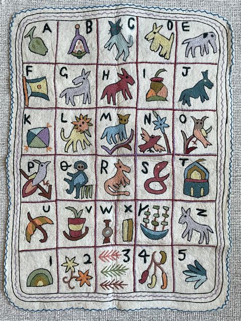 A gorgeous alphabet and numbers wall hanging hand crafted from pure wool according to the traditional Kashmiri 'namda' technique. The wool is hand-pressed into a felt canvas onto which hand-dyed woollen thread is embroidered. 90cm x 120cm approximately Alphabet Wall Hanging, Homeware Store, Alphabet Wall, New Babies, Heirloom Gifts, Nursery Playroom, Abc 123, Best Kids Toys, Alphabet And Numbers