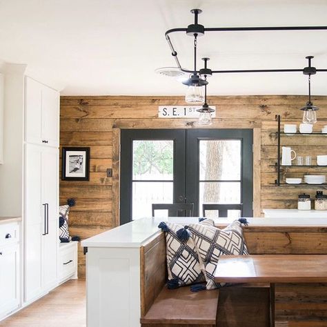 We love this kitchen from last week's reveal! The white cabinets, stained shiplap, black iron details, and built-in booth made this kitchen one of the most unique we’ve seen! Get ready for an all new Fixer Upper tonight at 9/8 CT on HGTV. #fixerupper Built In Booth, Stained Shiplap, Fixer Upper Kitchen, Shiplap Accent Wall, Shiplap Wall, Wood Walls, Pantry Door, Ideas Vintage, Ship Lap Walls