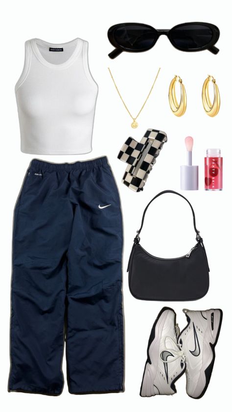 White tank top, navy blue nike track pants, Nike Air Monarch IV, small black handbag, white and black checkered claw clip, Fenty Treatz Hydrating + Strengthening Lip Oil, gold necklace with gold round charm, chunky gold hoops, round black sunglasses Nike Track Pants Outfits, Track Pants Outfit, Nike Track Pants, Dance Outfit, Vintage Pants, Dance Outfits, Travel Outfit, Vintage Nike, Pants Outfit